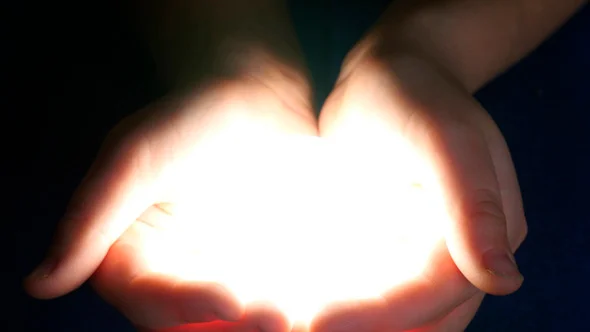 Boy Holding Light In Her Hands.jpg