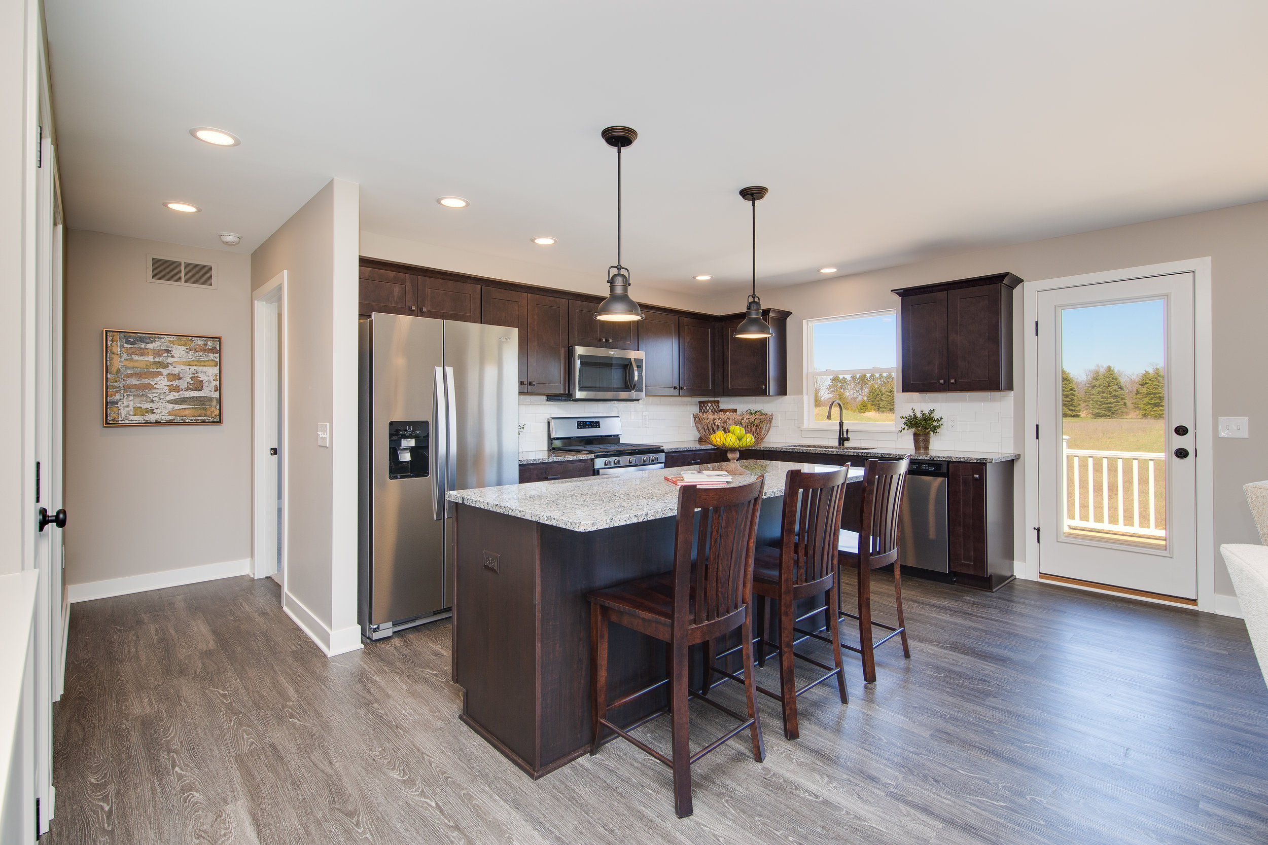 5+1+2018+AC-01-27-Aster_Kitchen_Stained+Cabinets_Granite_LVP[1].JPG