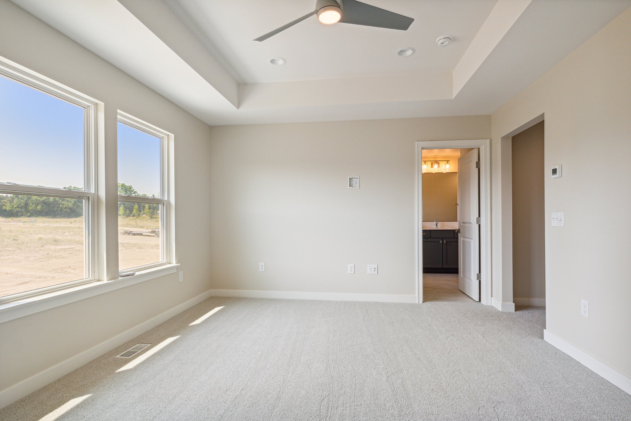 TS-01-36 Evergreen Primary Bedroom View to Bathroom.jpg