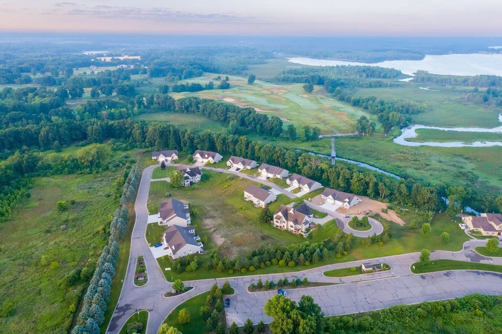 AC - Aerial View Far of Condos and Course.jpg
