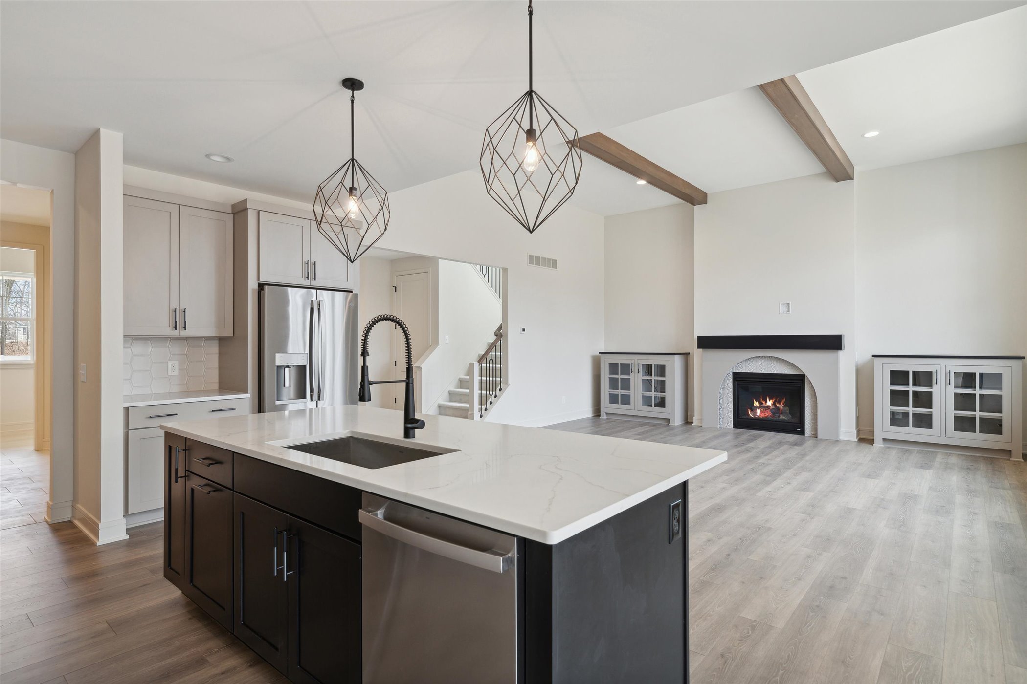 HL-04-148 Firethorn Kitchen View into Living room, celing beams, fireplace, built-ins.jpg