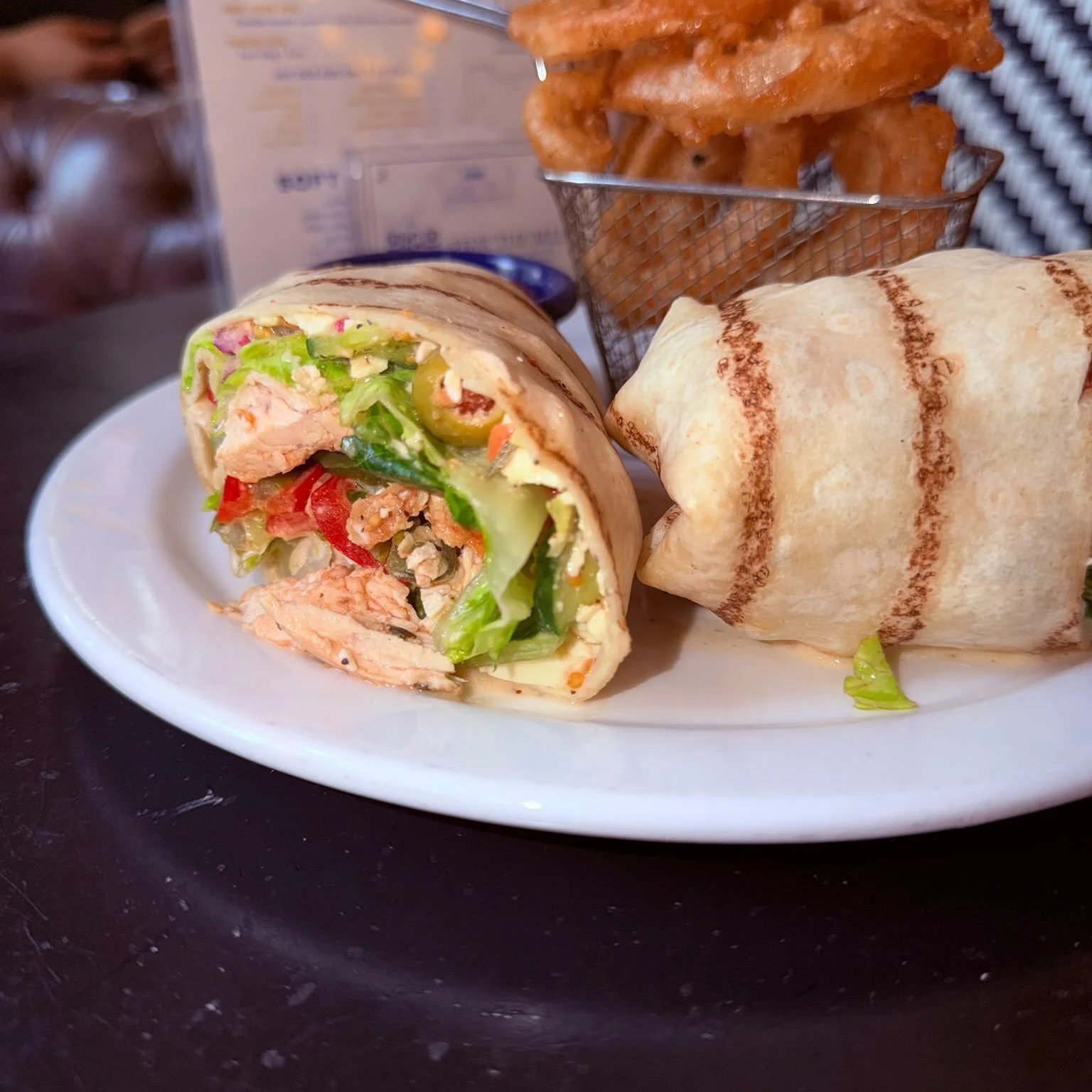 🇬🇷 August&rsquo;s B̶u̶r̶g̶e̶r̶ Wrap of the Month has arrived!

Fresh, bold, and packed with flavor.

🥙 The Greek Wrap
✔️ Grilled Chicken
✔️ House-Made Tzatziki
✔️ Fresh Greek Salad
✔️ Crisp Romaine
✔️ Wrapped and grilled to perfection

Served with
