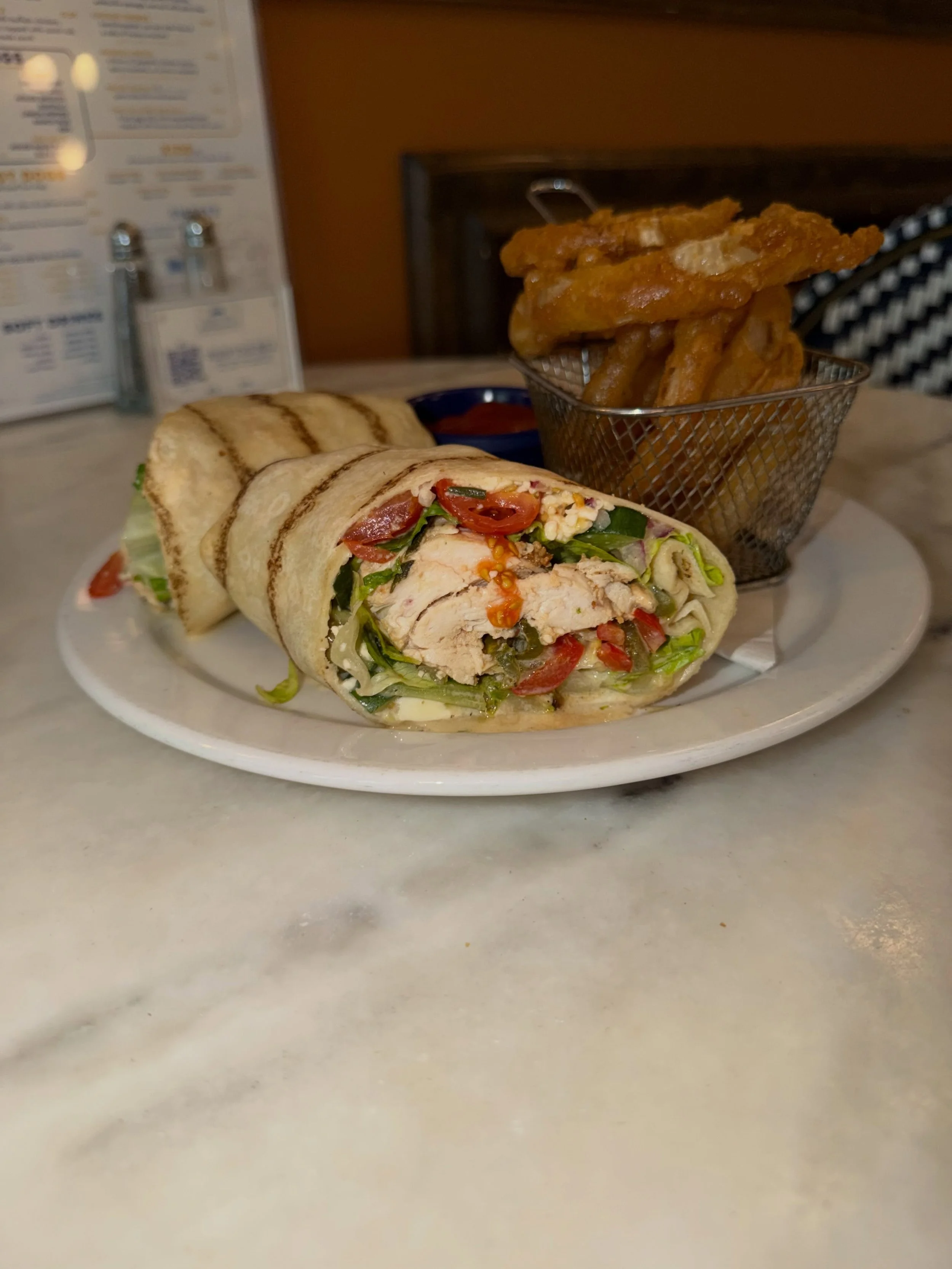 HAVE YOU TRIED AUGUST&rsquo;S WRAP YET? 🌯👀

If not, consider this your reminder.

August&rsquo;s Wrap of the Month is here and looking real good alongside a basket of onion rings. 🔥

And tomorrow? Preseason football is back. 🏈

Come grab your fav