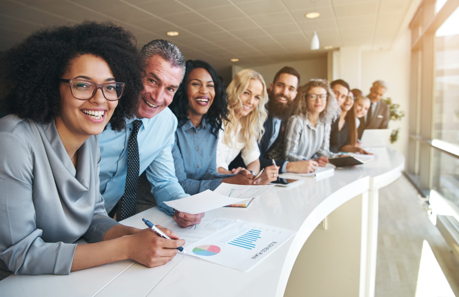 Cheerful-multiracial-colleagues-looking-at-camera-in-office-690855708_7107x4596.jpeg