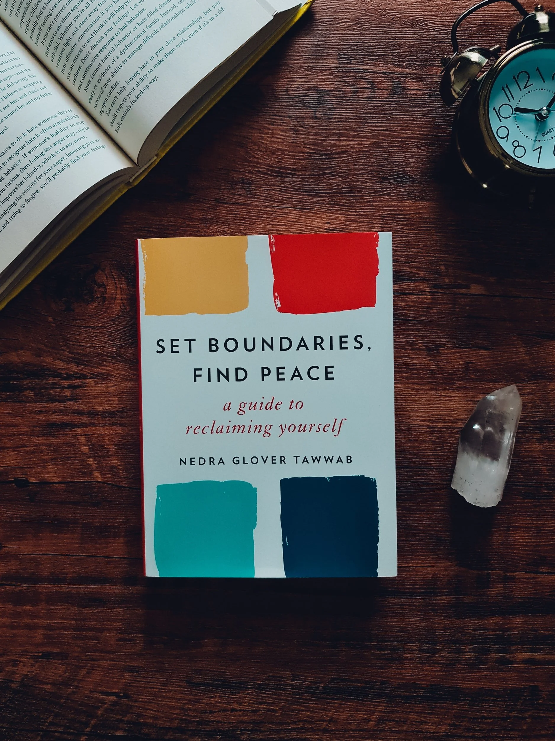 Set Boundaries, Find Peace A Guide to Reclaiming Yourself book by Nedra Glover Tawwab sitting on a dark wood table
