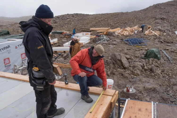Paul (crouching) and Neil from Mag Pro measuring base plates. Photo by Will Schmidt.