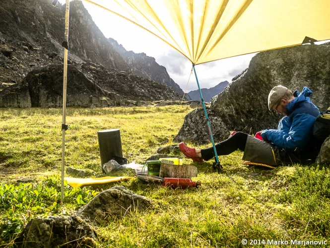 Peter Knamiller relaxing in the evening sun at “Milk & Honey” camp. That evening we awoke to a sky full of Northern Lights.