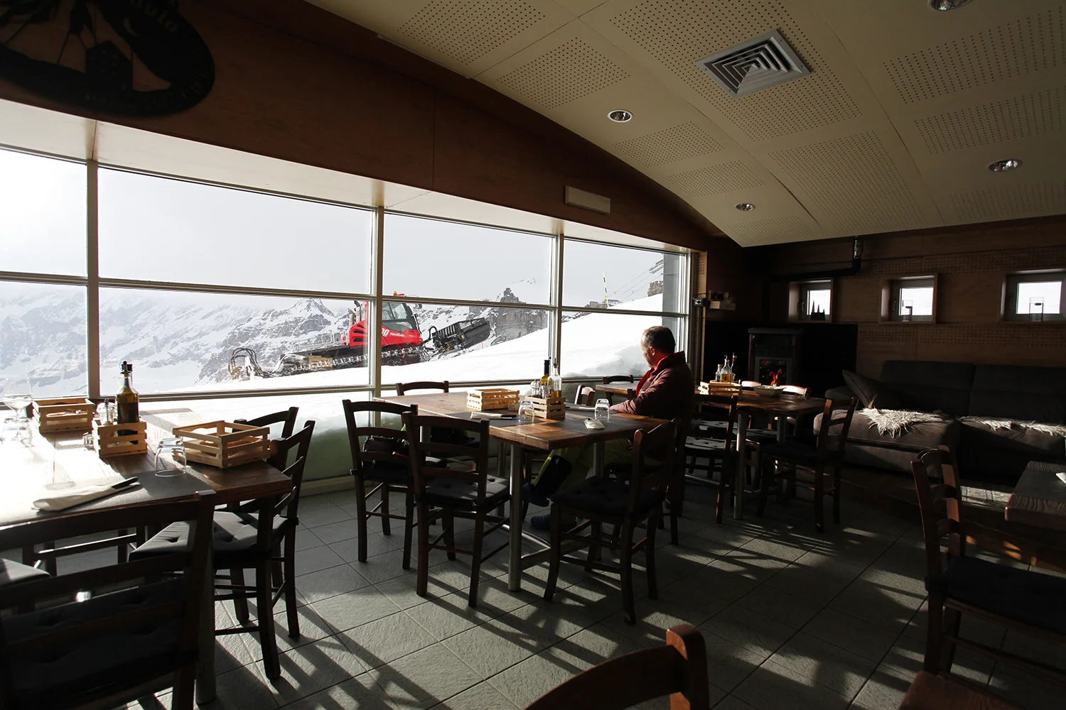 The recently renovated Theodule “Hut" (3,317 m) on the Italian/Swiss border. The chairlift coming from the Italian side ends 50 m from the hut. The lift coming from the Swiss side ends just above the hut, so you can easily ski in, drink a beer or espresso, and carry on down either the Italian side or the Swiss side. The Matterhorn is just a few kilometres away, but we only got to see it in parts due to the cloudy skies. I was surprised and highly entertained by the snow groomer passing in front of our panoramic window at dinnertime. The huts are different in Europe! Photo by Nancy Hansen.