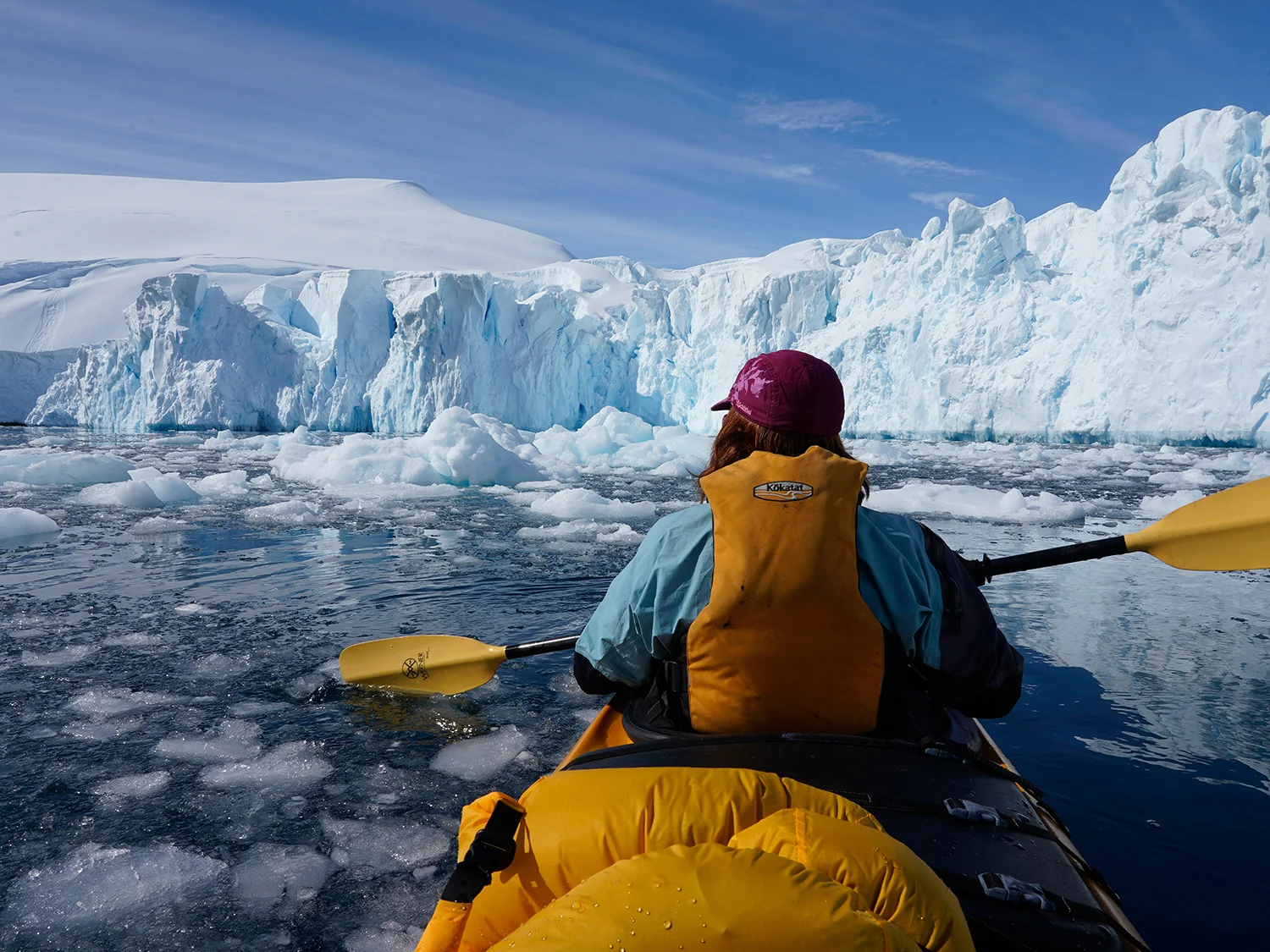 Sea kayaking amid ice and seracs. Photo by Ralf Dujmovits.