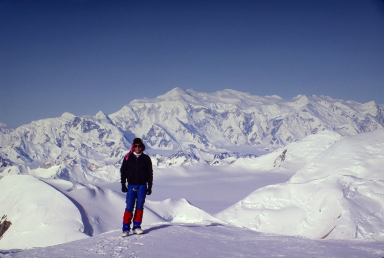  Bill on the summit of Donjek with Mount Logan massif in the distance. Photo by Roger Wallis. 