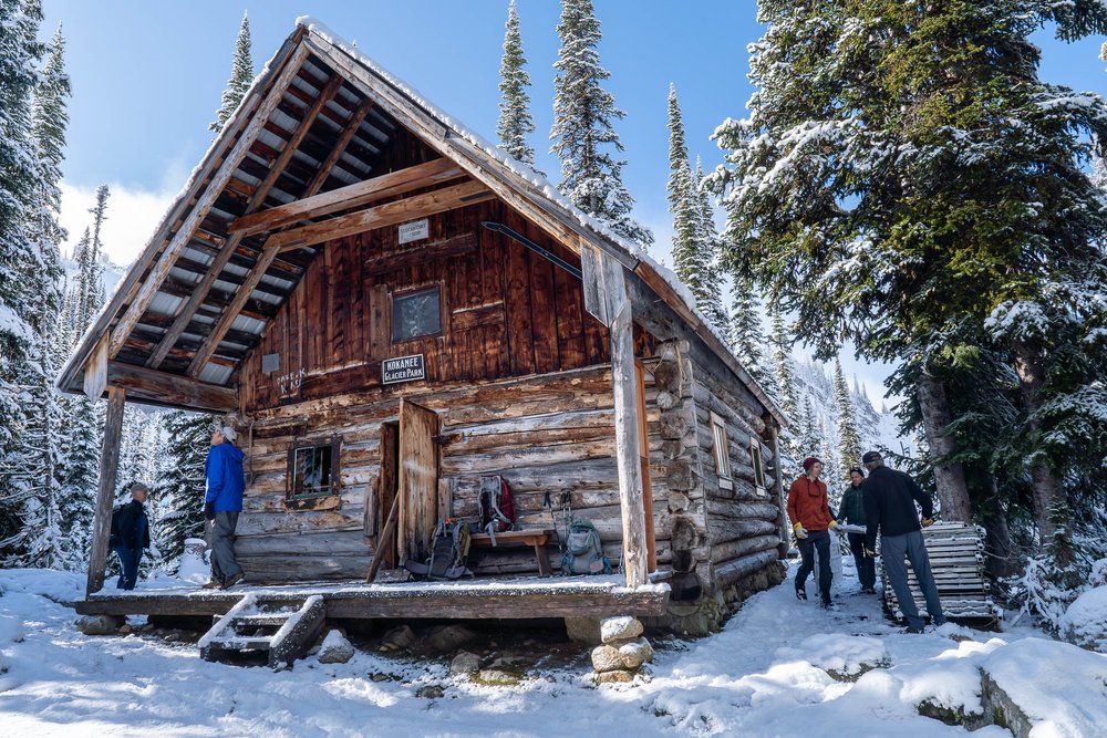  ACC custodian Petra Hekkenberg and Ben Smith prep the Slocan Chief cabin for winter with weather-proof panels, Kokanee Glacier Provincial Park, Selkirk Range near Nelson, BC.  