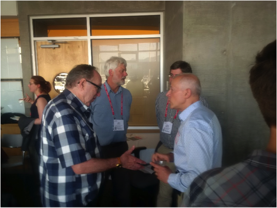 Figure 1: Life-time membership awardee, Andrew Nevin (left), talks to Carlos Salas (right), GeoscienceBC , about his lifelong career in exploration.