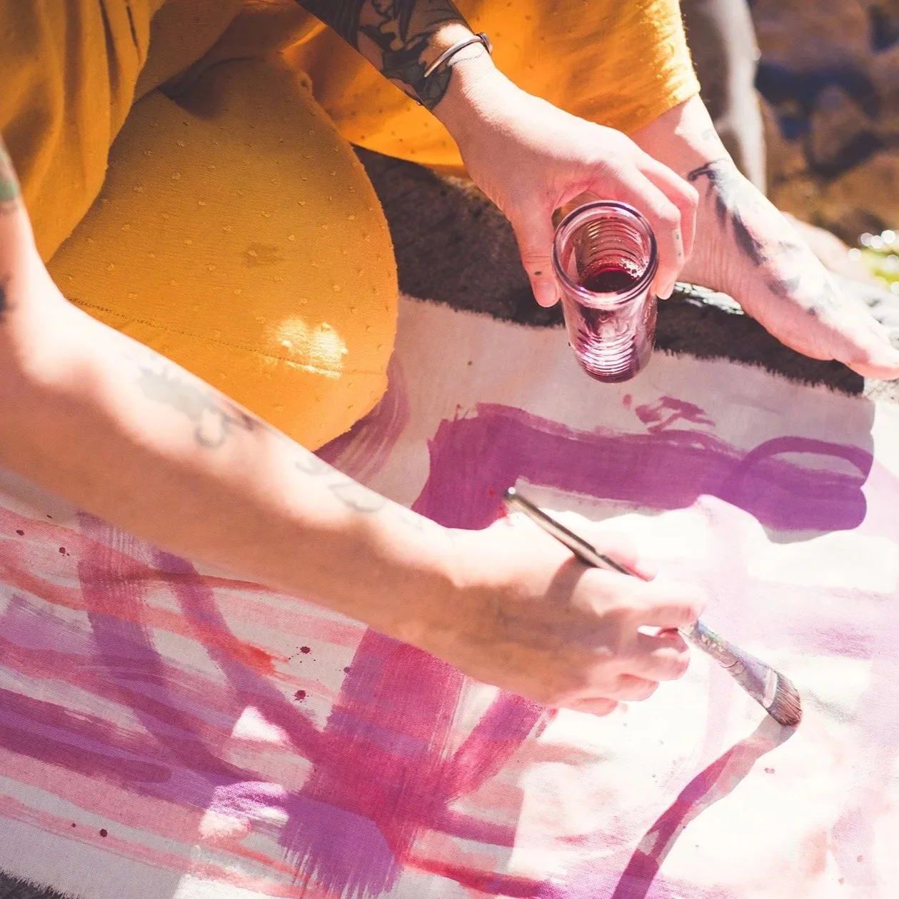 Jill Sans painting with ink made from blackberries found in Oak Creek Canyon.