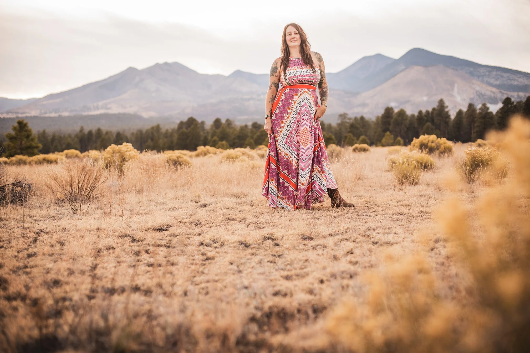 Jill Sans, artist in Northern Arizona. Standing in front of the San Francisco Peaks.
