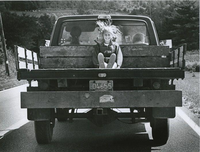 Girl in Back of Pickup Truck