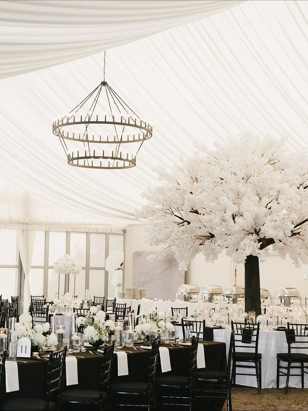 M+T&rsquo;s reception was straight out of a dream ✨ From towering floral trees to candlelit tablescapes, every detail came together to create a setting as timeless as the celebration itself. We will forever have a love for a classic black and white w
