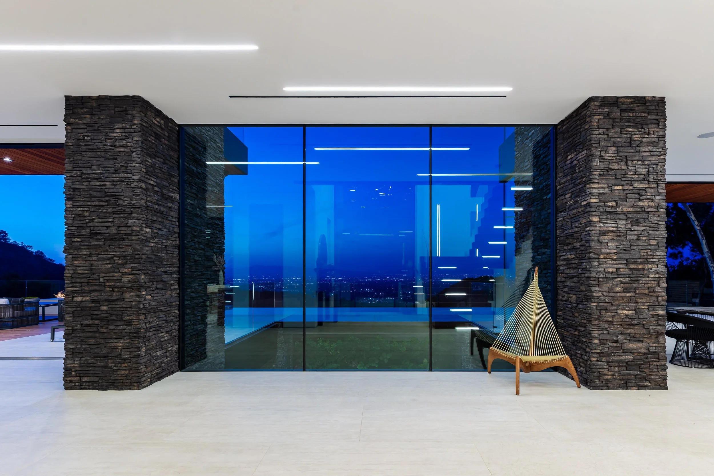 Architectural interior photography of a Los Angeles home with night pool and city views