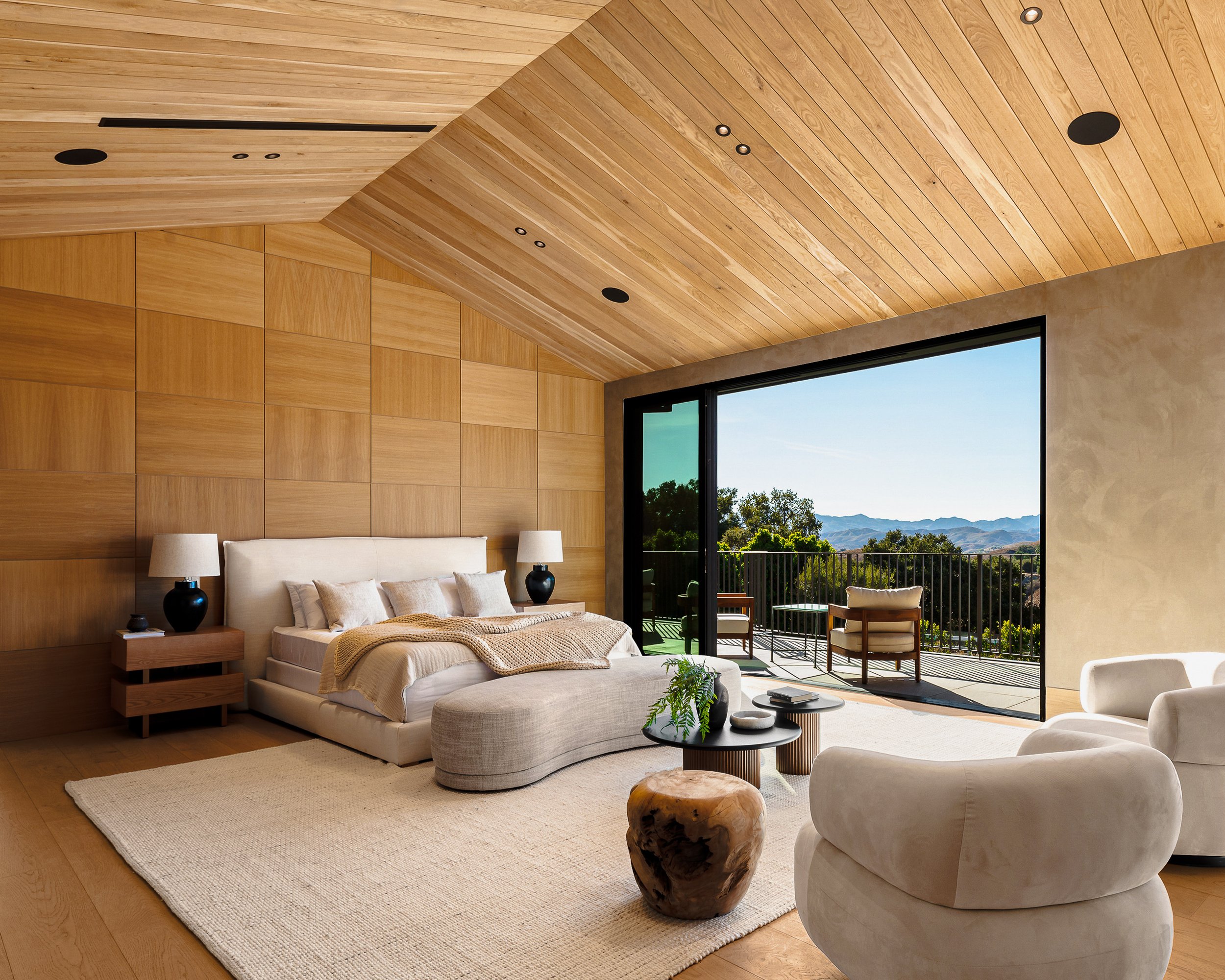 Los Angeles real estate photography of a modern bedroom in a luxury home by Wayne Ford.