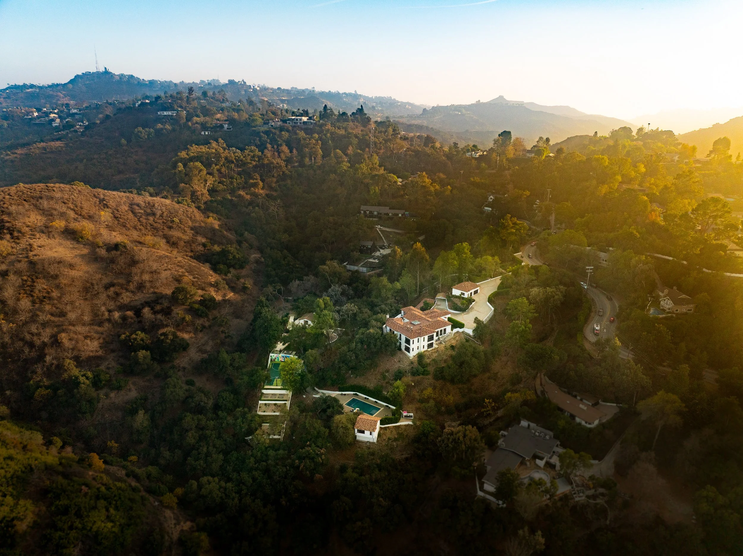 Drone real estate photography showing a Hollywood Hills hillside property.