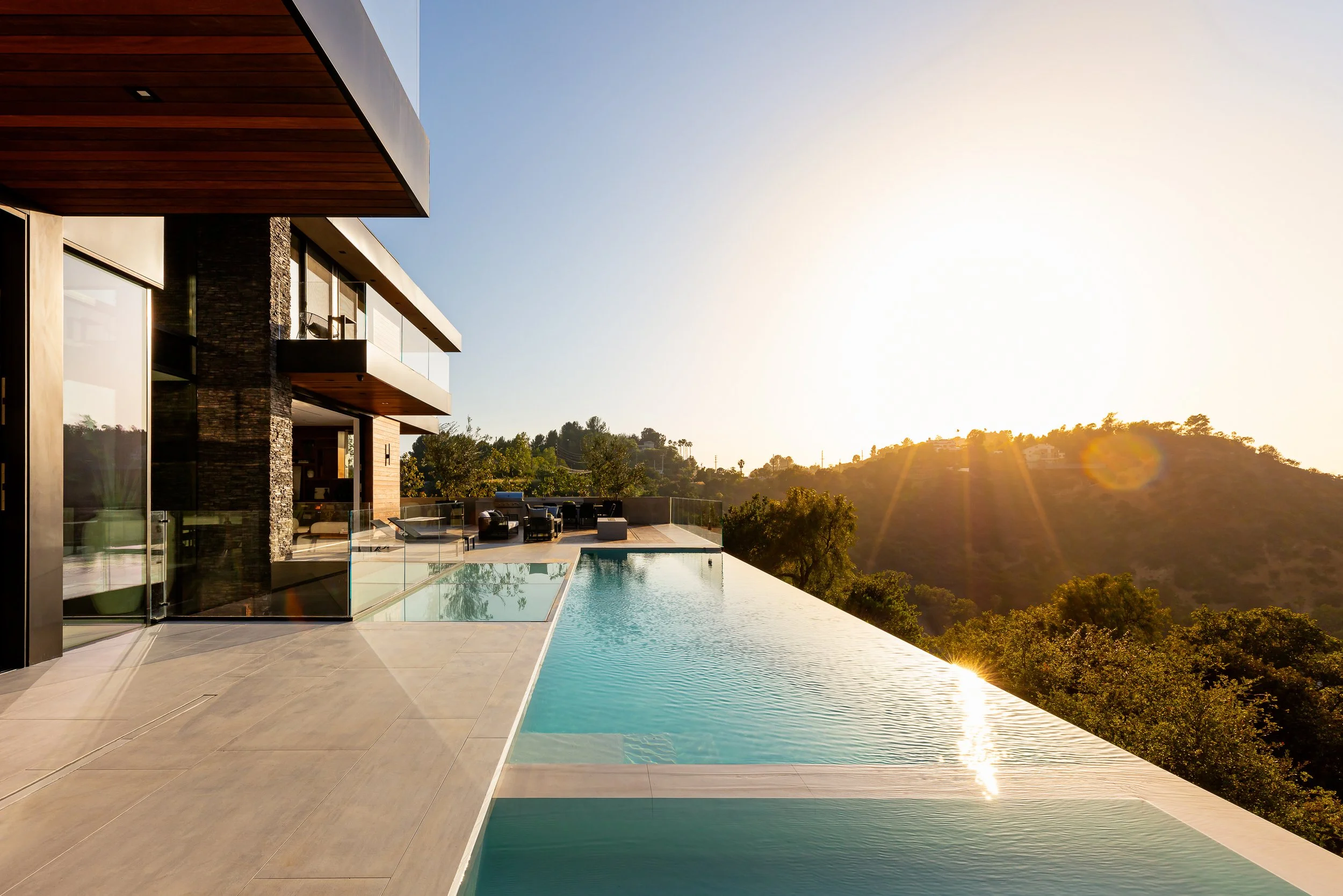 Architecture and design photography of a modern Los Angeles home with pool at sunset.