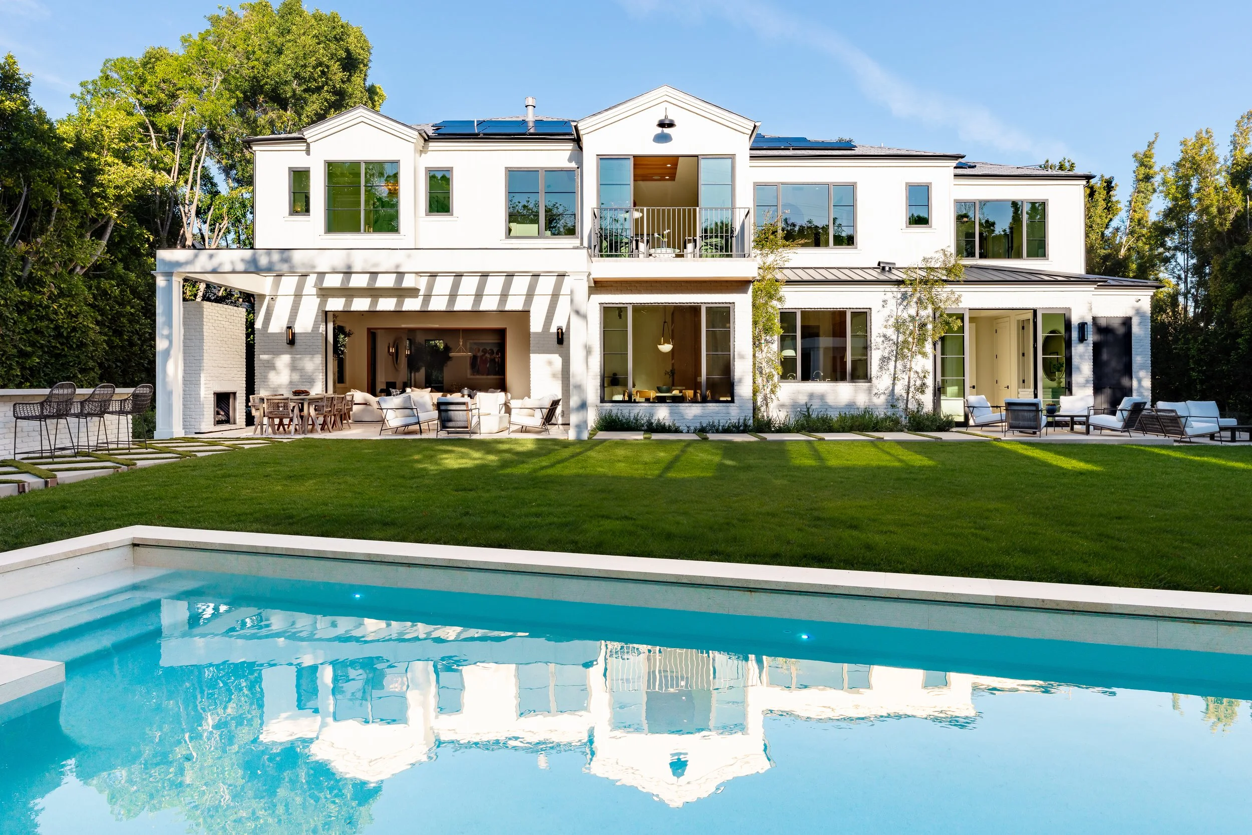 The backyard and pool of a luxury Beverly Hills home.