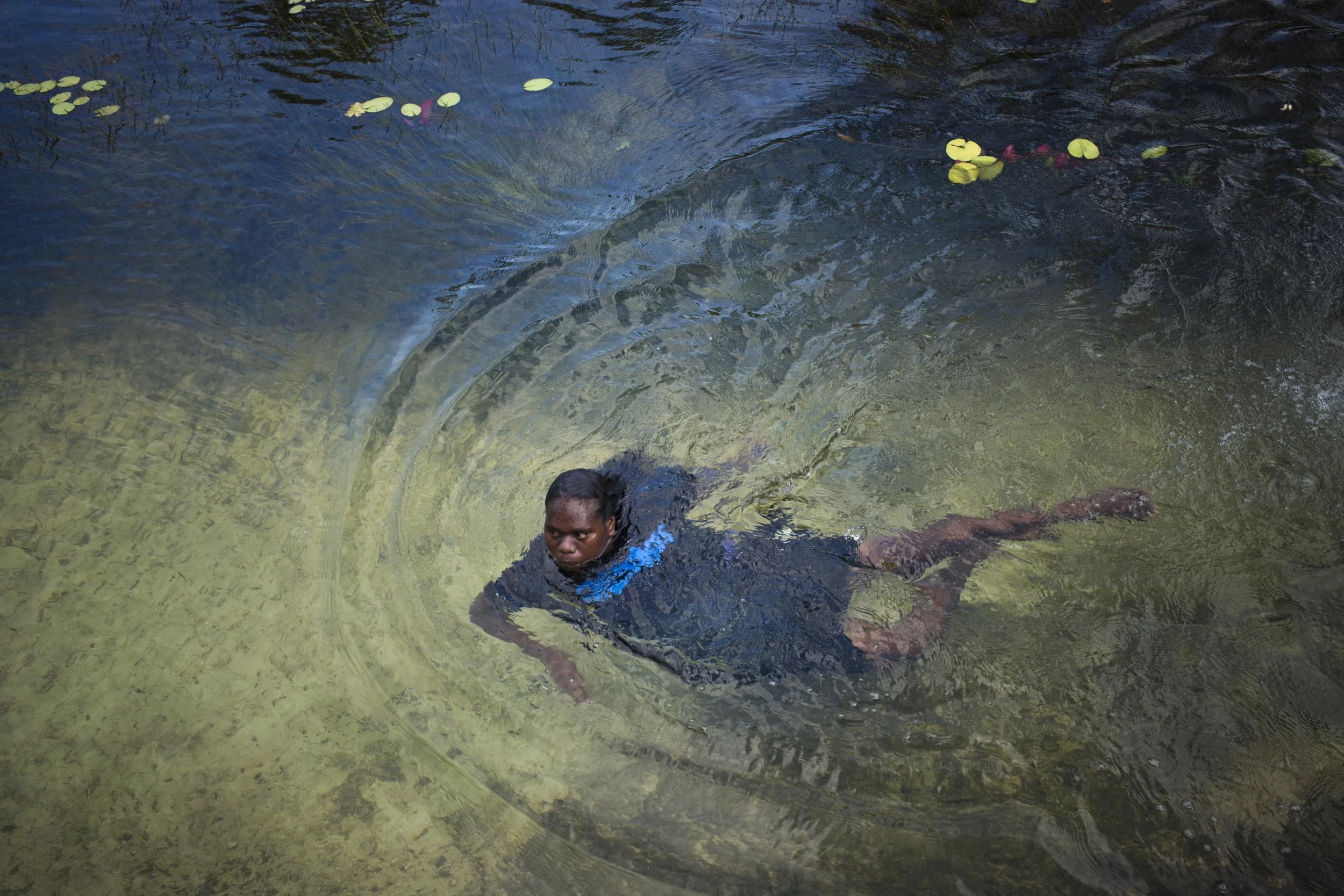 A woman swims in a freshwater spring on Melville Island, Northern Territory.