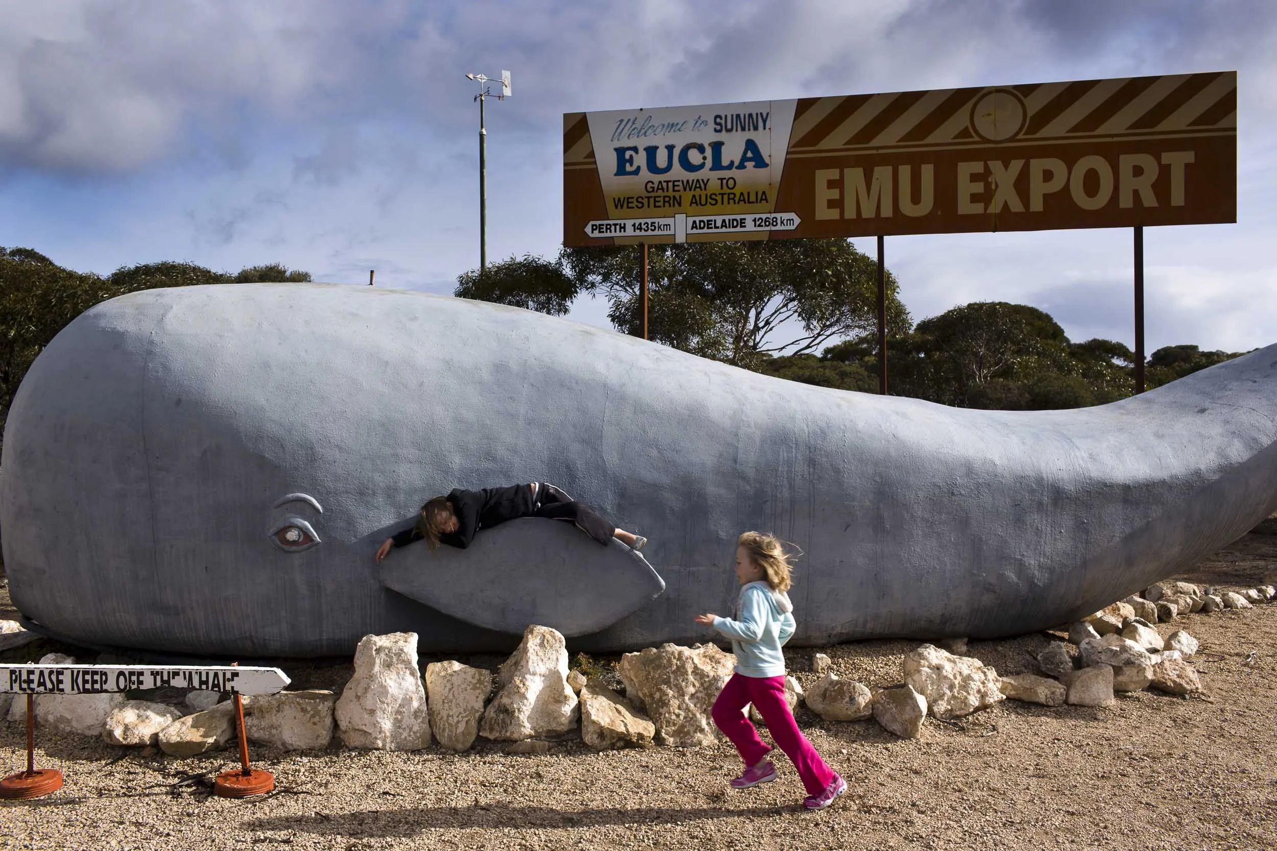 Children play on a whale statue in the Western Australian town of Eucla along the Eyre Highway, Eucla, Western Australia.