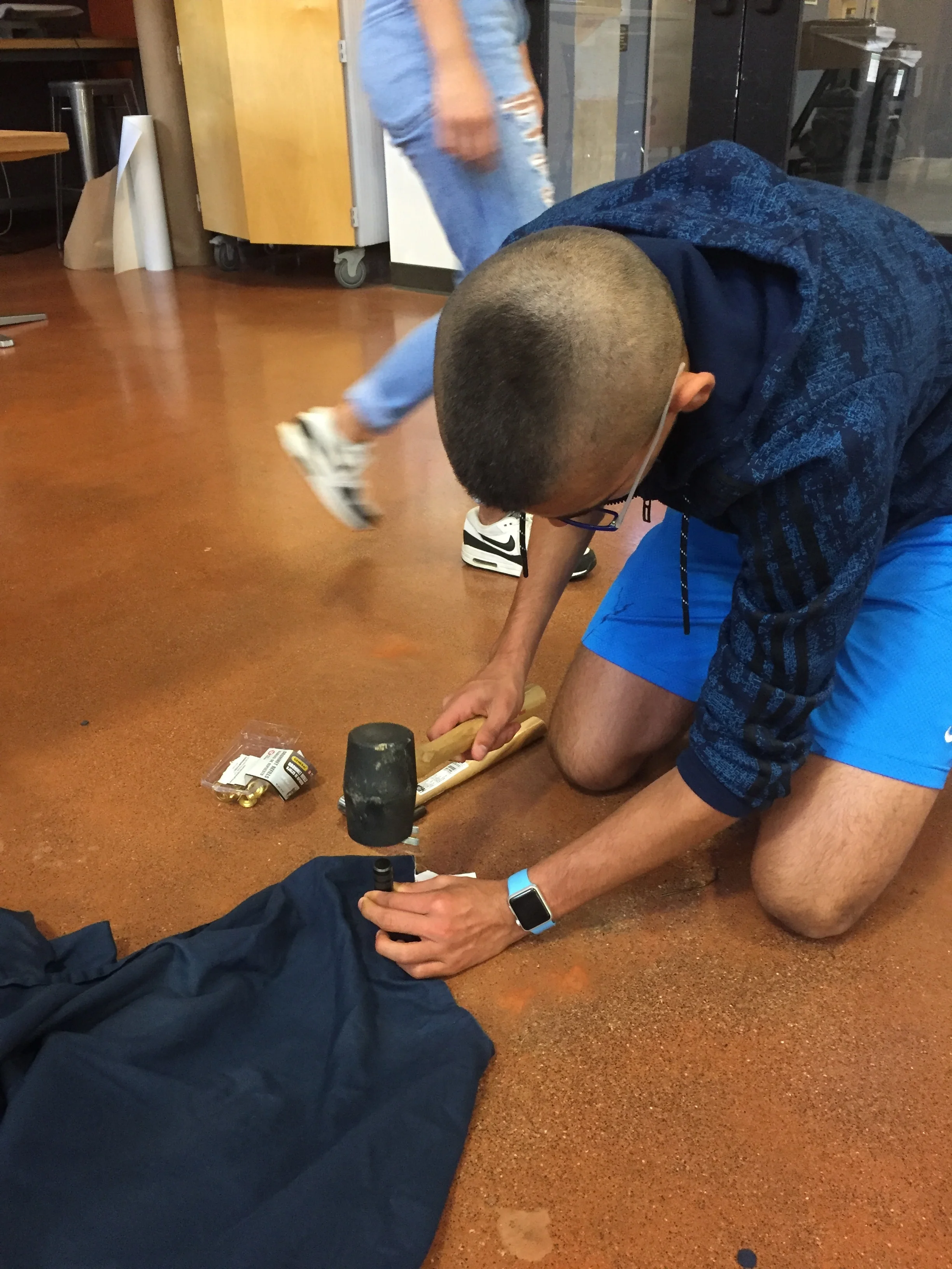 Student using hammer