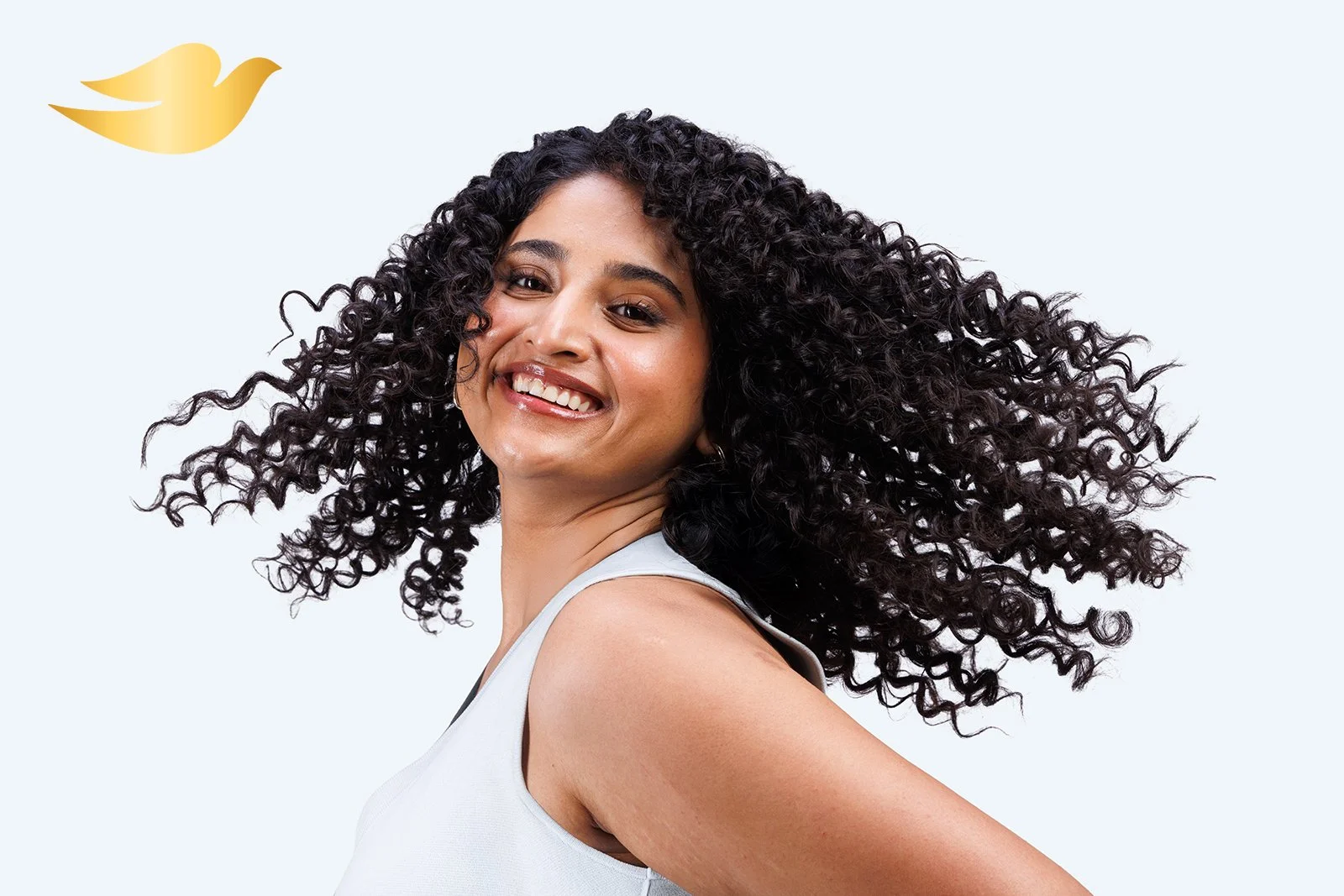 Commercial hair photography for Dove, capturing natural curl definition, texture and movement for its curly hair care range.