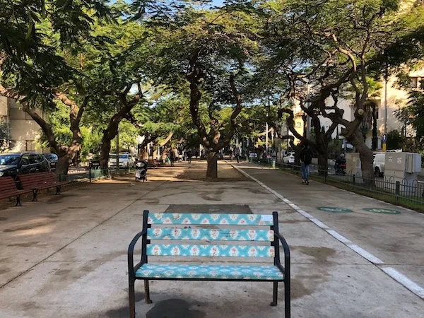 A decorated traditional bench on Rothschild Boulevard in the center of Tel Aviv