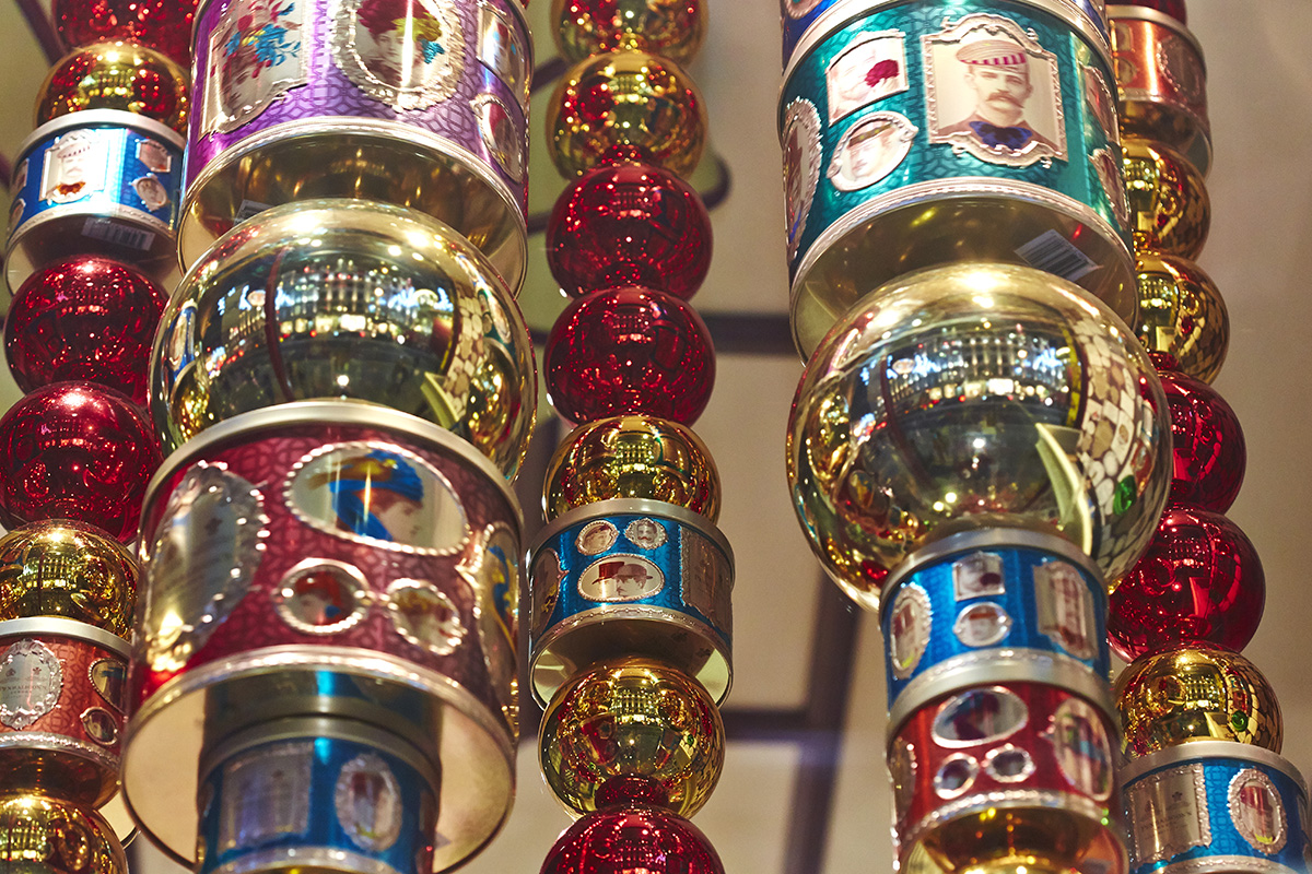 Stacked tins and baubles spinning window display