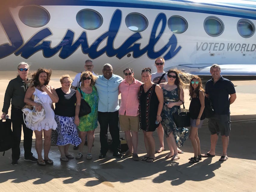 Standing on the tarmac after a private tour between islands on the Sandals pria=vate jet. Peter is last man on the left.