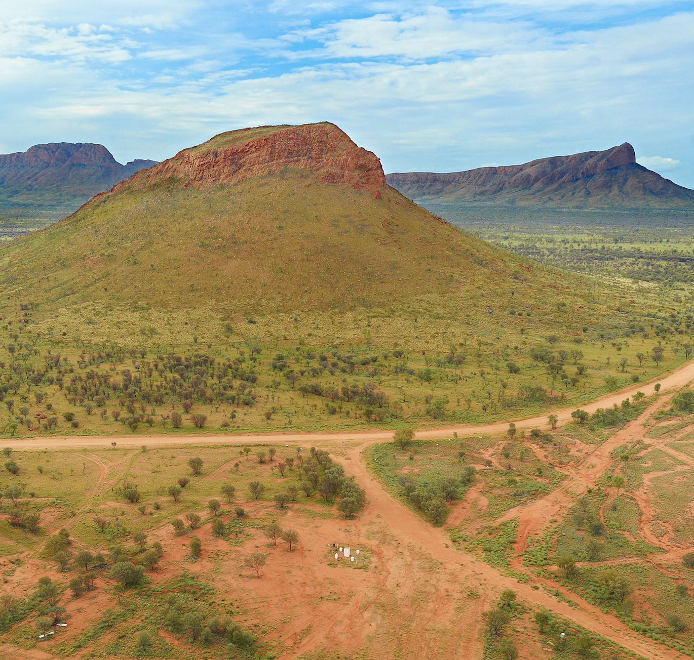 Memory Mountain or Round Hill which in local language is Kurrkalnga Puli is at the intersection of the Glen Helen-Papunya Road and the road to the Ikuntji community. It's just over 230Km west of Alice Springs.