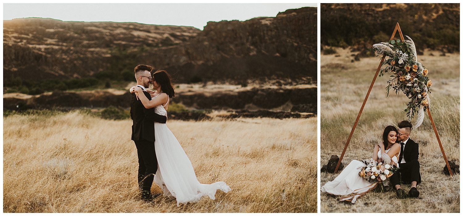 a bride and groom embrace at their elopement site, where they have a beautiful wooden triangle arch and flowers set up