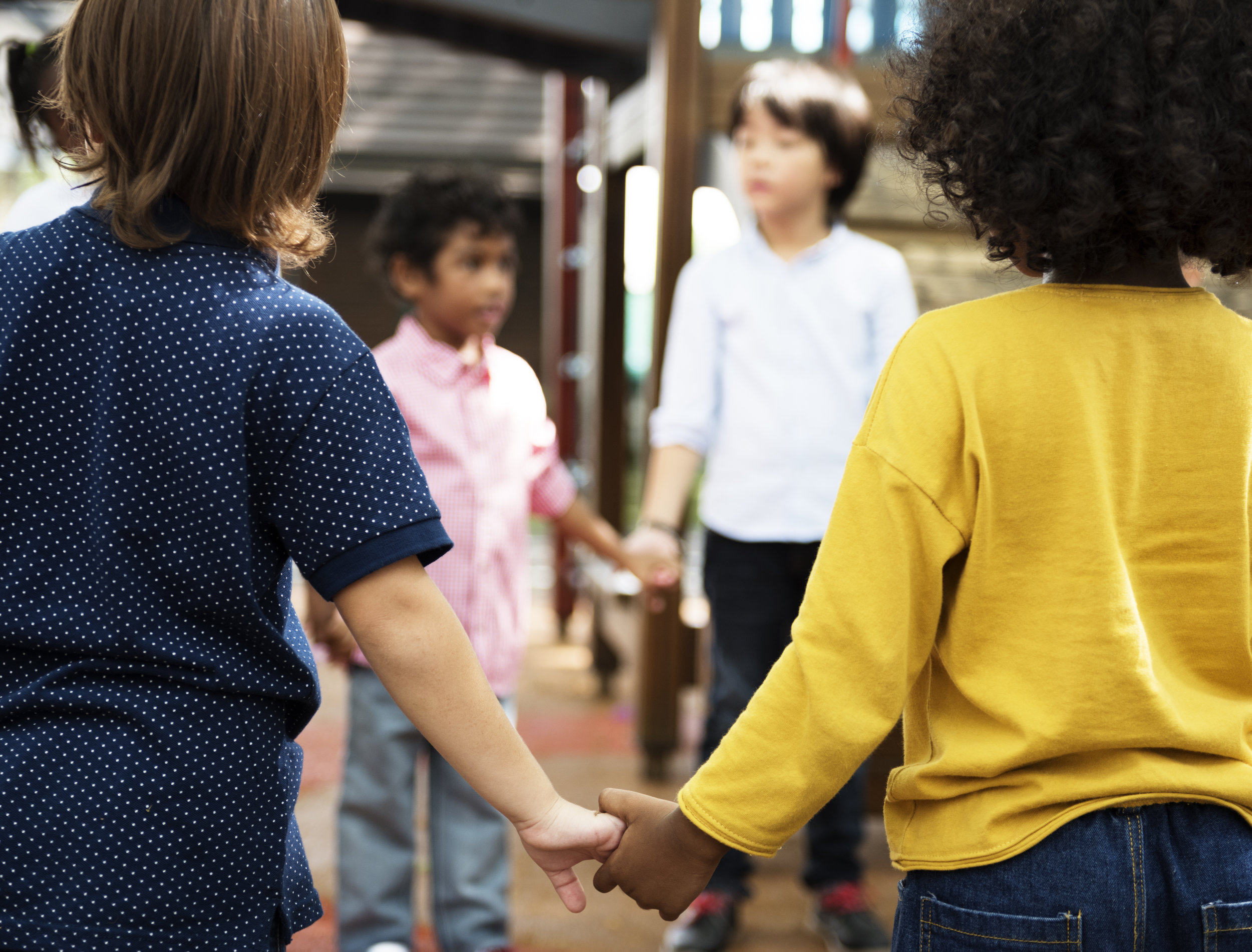 photodune-20024352-group-of-diverse-kindergarten-students-standing-holding-hands-to-xl.jpg