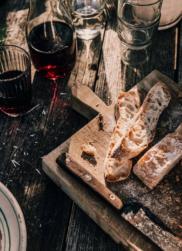 Red wine and bread styled on location in Florence for Hardie Grant books
