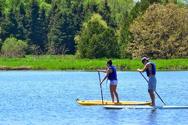 Option: SUP Yoga or Windmill tour.As the focal point to this fabulous 200 acres of forest and 40-acre lake is a windmill, yes an authentic windmill in the middle of Southwestern Ontario. Rub your eyes all you want, but this is no mirage, it’s an oasis within the Ontario.The property was once owned by a man named Folkert (Frank) De Jong. Frank started construction on a windmill in the 1970’s following the death of his sons. Roughly 17 years later, De Jong had built one of the only wind driven saw and grist mills in North America, modelled after Holland’s famous Arend windmills.The attention to detail in the structure is completely awe inspiring, and work is underway to restore this piece of local history.
