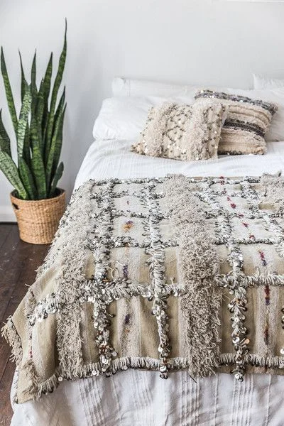 This authentic Moroccan Wedding Blanket and cushions really makes this simplistic, miniaml bedroom.