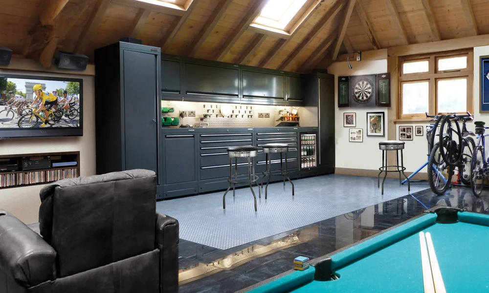 Well designed garage with lots of storage space, pool table and tv