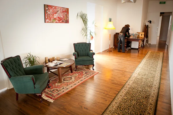 Decadent green chairs with a polished wooden floor
