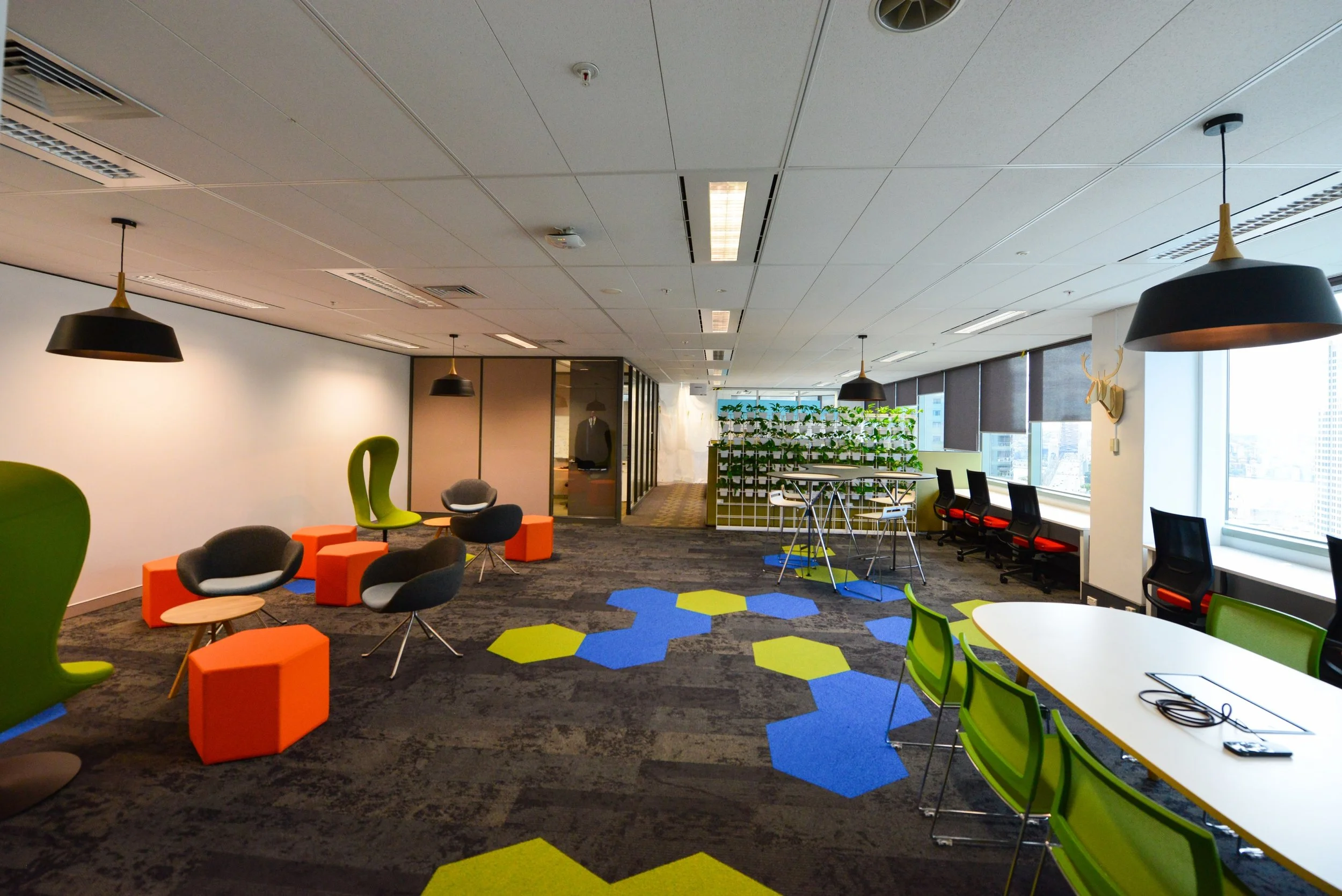 Multi-coloured carpet with matching seats of different shapes and sizes