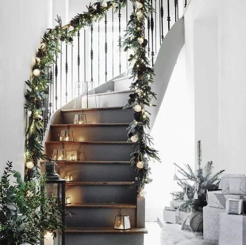The Stairs - I love this staircase! doesn't it look magical with the foliage and twinkle lights wrapped around!