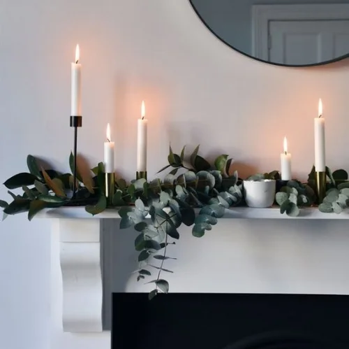 Simple and Classy - the simplicity of this mantel piece makes it a winner, investing in some beautiful candle holders makes all the difference.