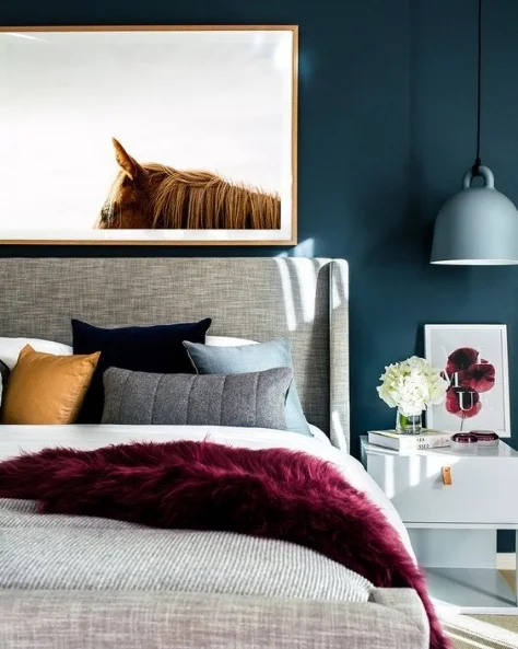 We are loving Teal at the moment. These beautiful jewel tones create a rich, warm and welcoming environment, ideal in a cozy bedroom! A simple art piece like this breaks up the darkness of the wall and helps reflect light.
