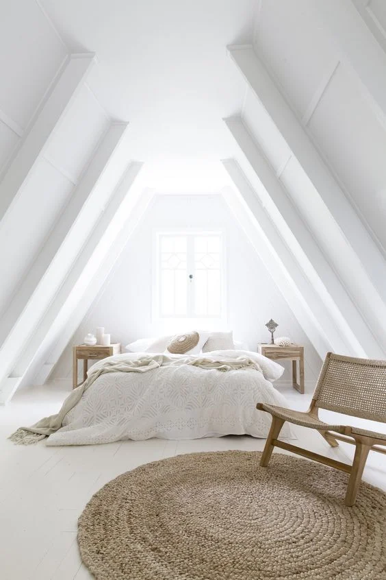 This gable ceiling could of been a disaster! but by going all white the ceiling doesn't feel as enclosing as a darker colour might of in this situation. A darker colour with a white back wall would of emphasised the narrowness at the top of the apex making it feel enclosed.
