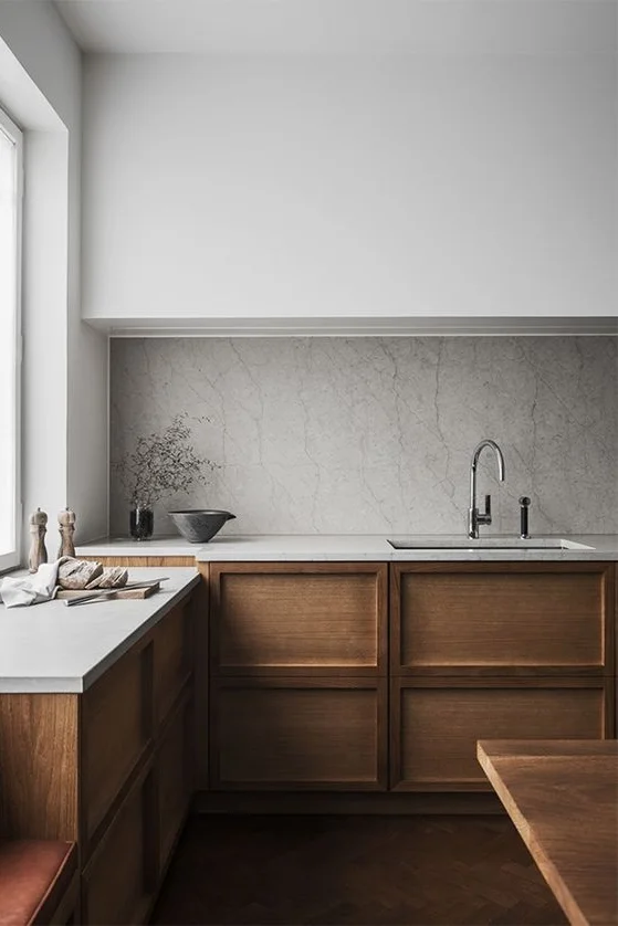 This traditional style kitchen looks incredibly luxurious, veneer draw fronts with the recess detail, herring bone floors, slim bench top and slim tap ware looks gorgeous and rich.