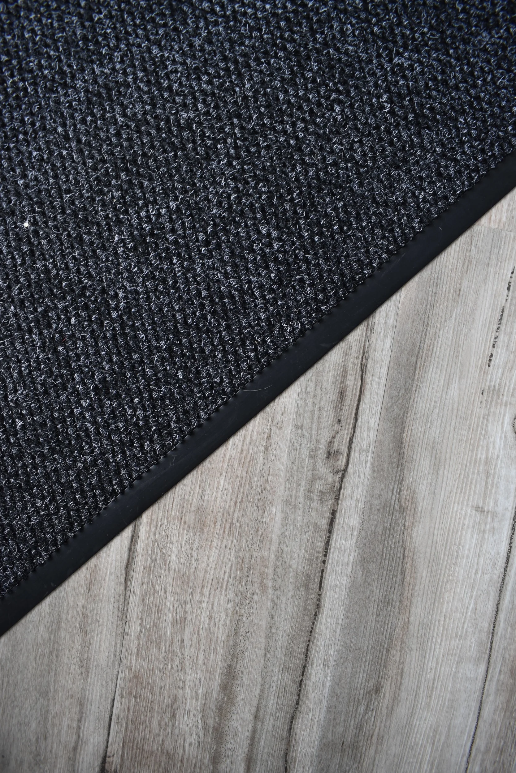 We installed a new beautiful charcoal safety matting at the entrances that sit flush with the wood plank vinyl. This gives a much tidier appearance than a loose matting which can be a trip hazard.