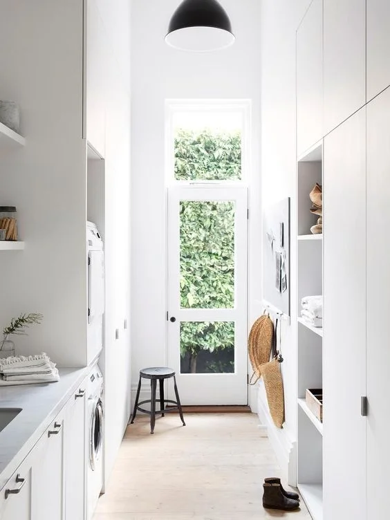 I love this family laundry because they have utilised the high ceilings for extra storage. Even when some cupboards are only accessible by standing on a step ladder, they are still worth while! They are perfect for things you don't need access frequently such as Christmas decorations and suitcases etc.