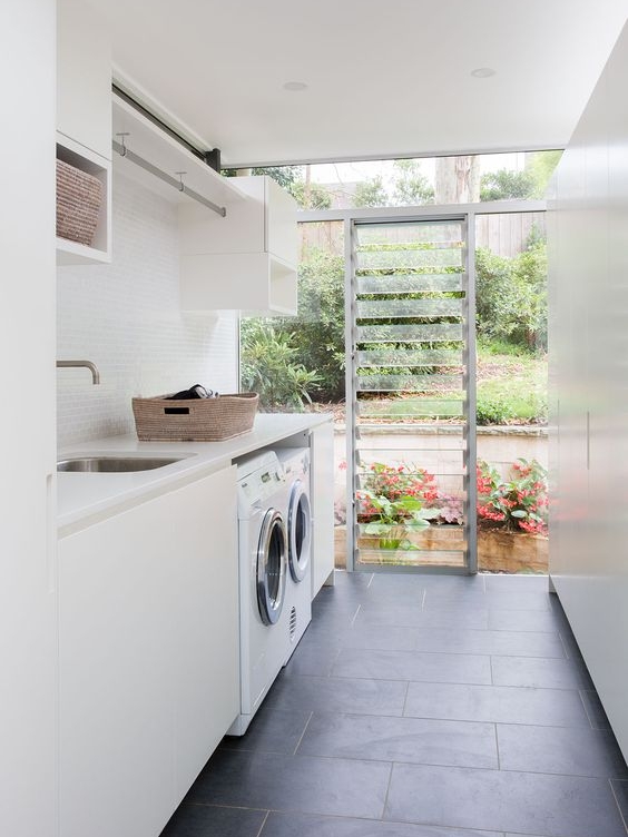 I think these louvers are such a wonderful idea for laundries! they provide fantastic ventilation. I always like to include a hanging rail where possible just like they have done, it is so handy in colder months to be able to hang things indoors, even better when hung over the sink so any drips don't sit on the bench top.
