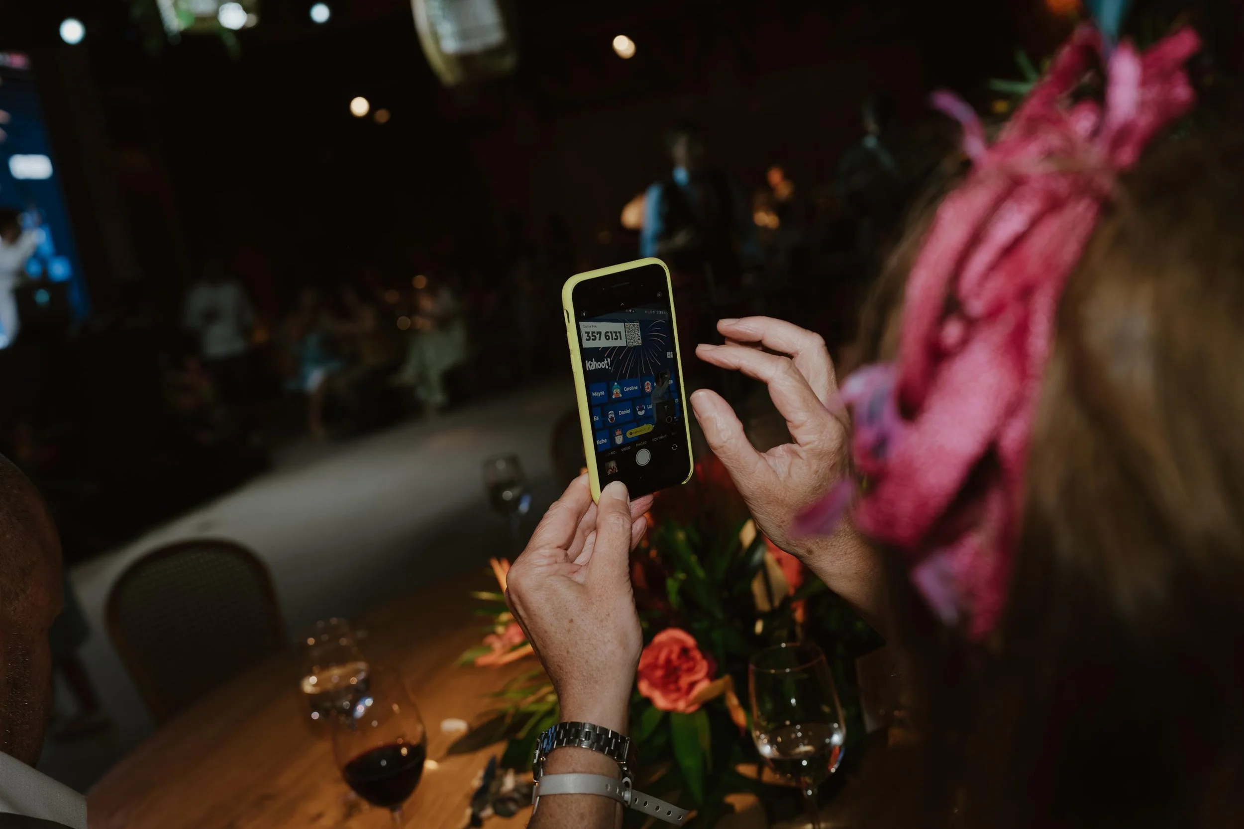 Candid and energetic wedding reception party in Punta Cana, with guests dancing and celebrating under warm lights